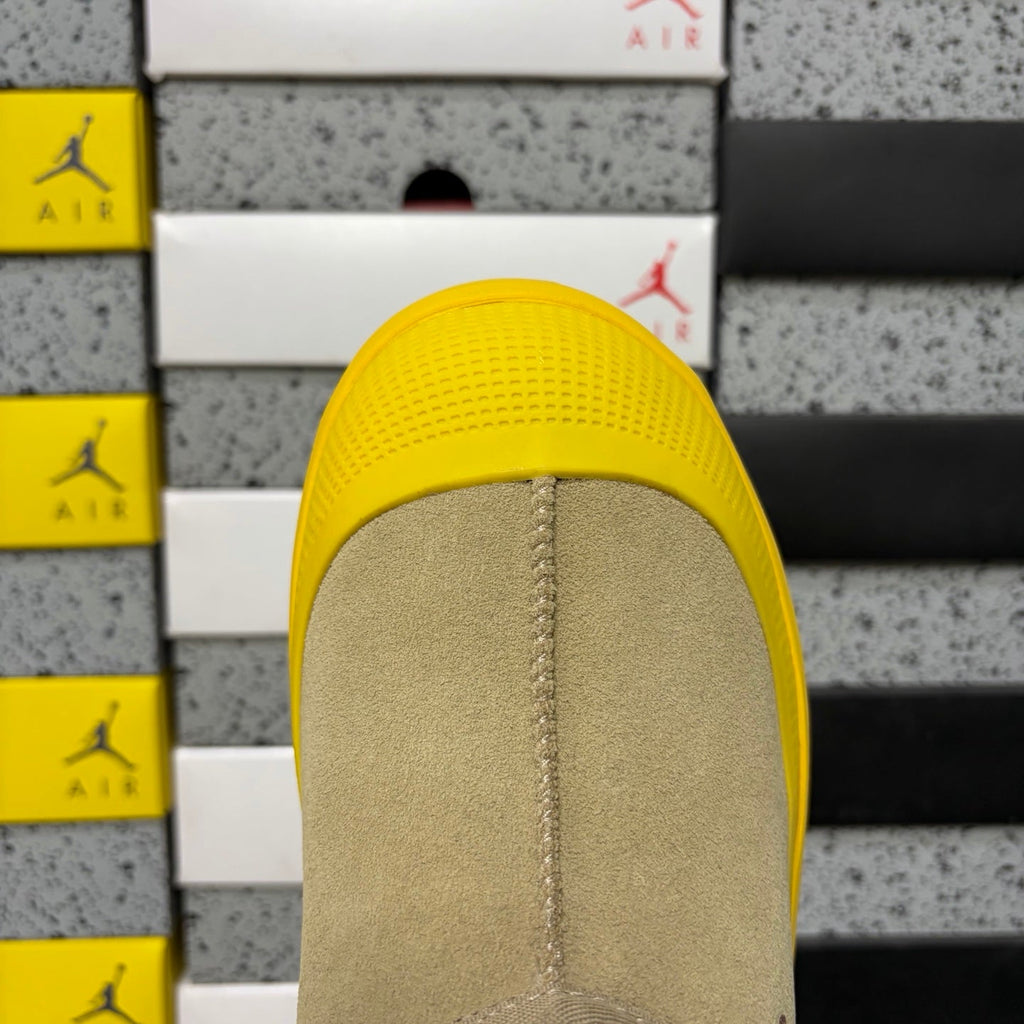 UGG Neumeel Deco Slip-On – Suede Moccasin Sneaker with Yellow Lug Sole & Carabiner Collar in Sand